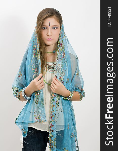 Fashion girl showing jewelry and blue scarf. Fashion girl showing jewelry and blue scarf