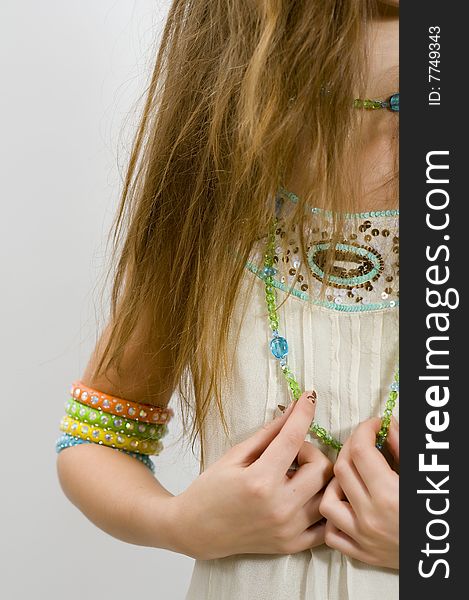 Long haired fashion girl showing colored fashion bracelets. Long haired fashion girl showing colored fashion bracelets