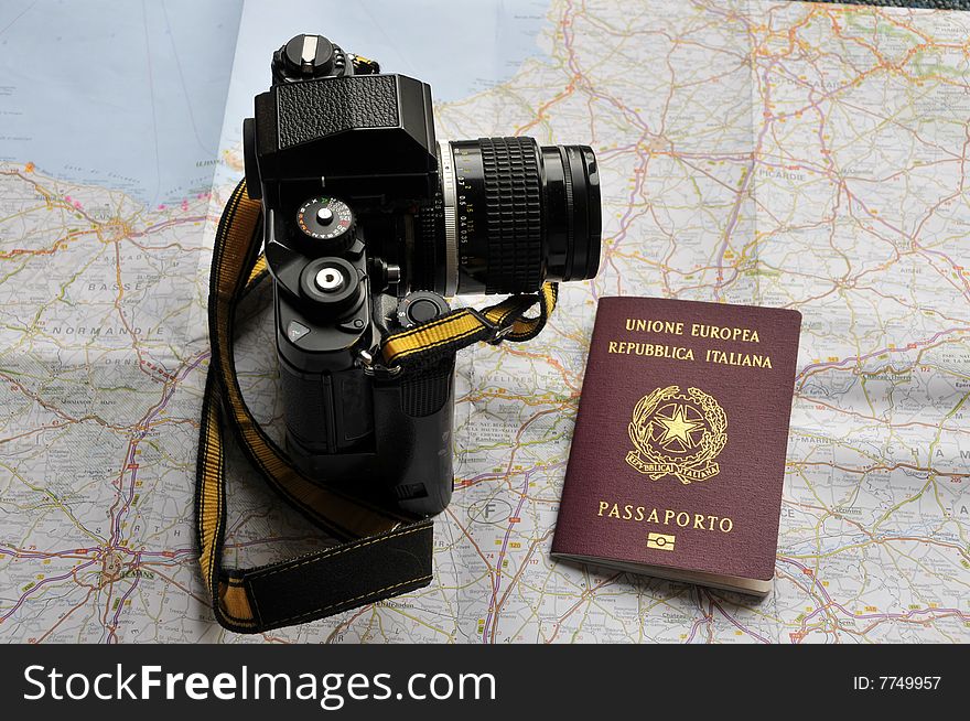 Map, passport and camera, preparing for a trip