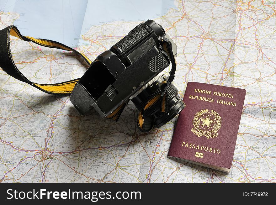 Map, passport and camera, preparing for a trip