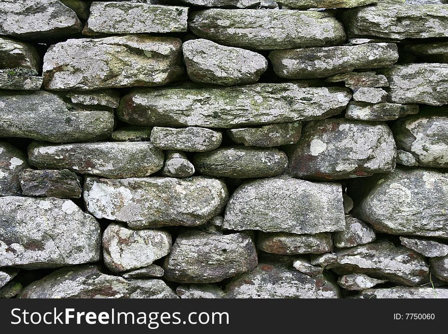 Old stoned wall as background. Old stoned wall as background