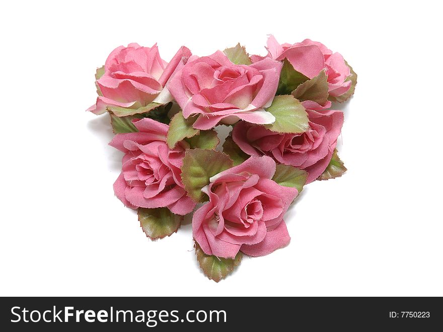 Heart made of roses isolated in white