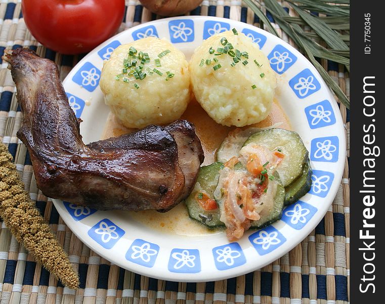 A fresh meal of rabbit meat with potatoes and zucchini