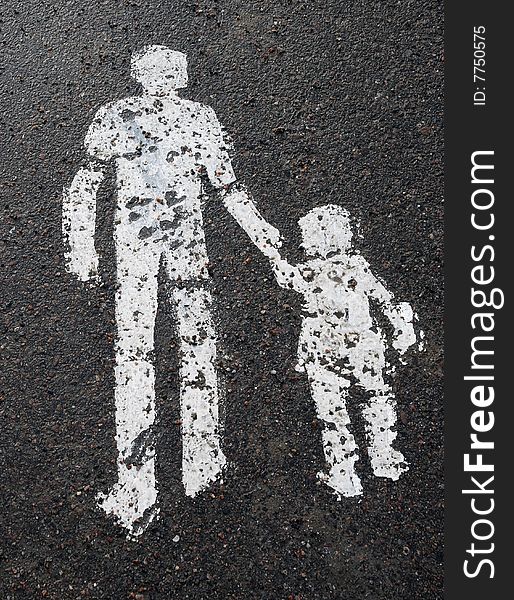 A man with a child painted on the asphalt. A man with a child painted on the asphalt