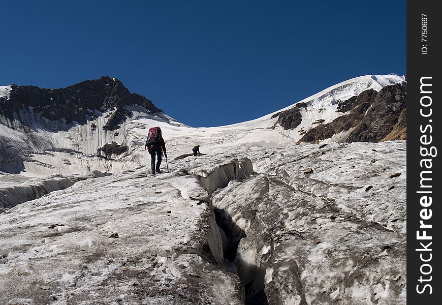 Climbers go on glacier, ice.