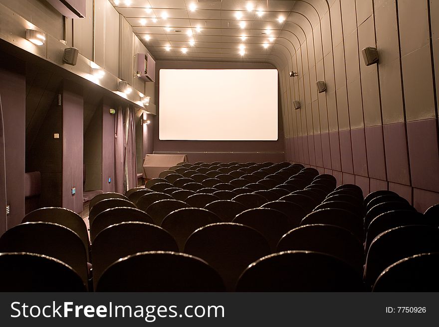 Empty small cinema auditorium with chairs