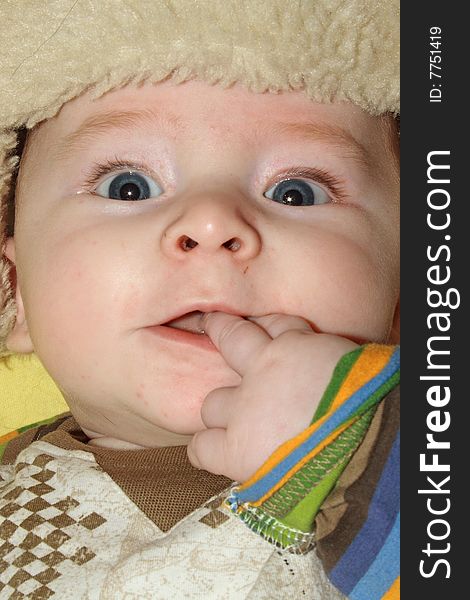 Close up portrait of infant with funny expression. Close up portrait of infant with funny expression