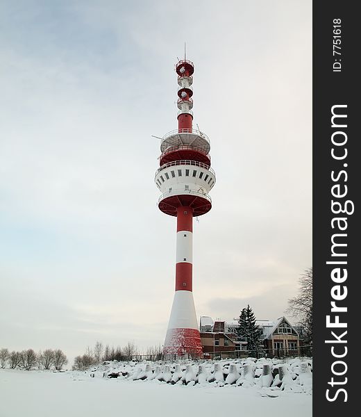 Beacon on a coast of the Finnish gulf in the winter. Peterhof . Beacon on a coast of the Finnish gulf in the winter. Peterhof