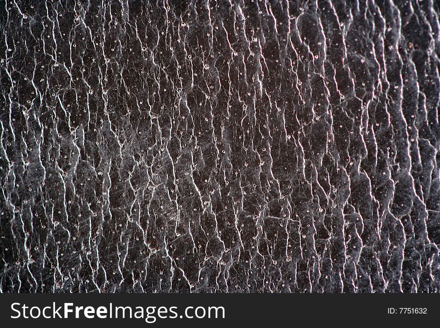 A Black leather macro abstract background. A Black leather macro abstract background