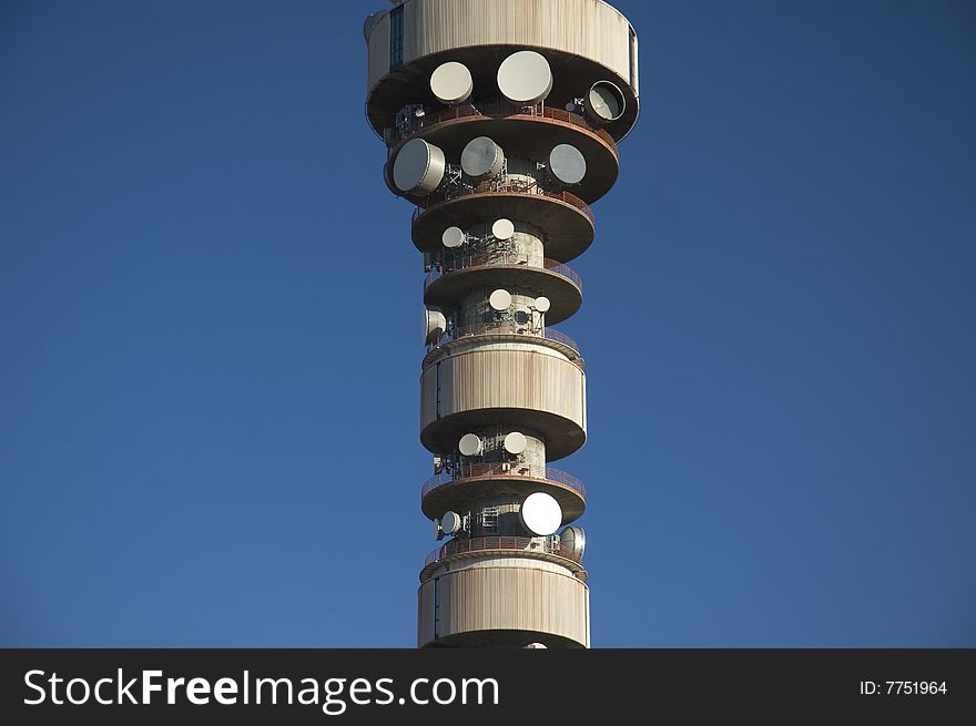 Communication antenna tower in blue sky