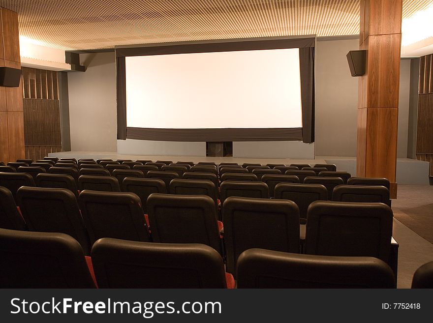 Empty small cinema auditorium with chairs