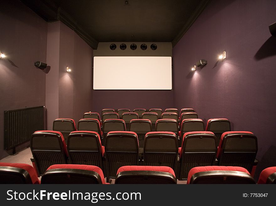 Empty small cinema auditorium with chairs