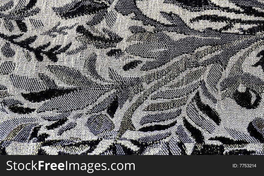 A close up shot of some black and grey material. A close up shot of some black and grey material