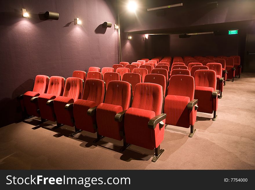 Empty small cinema auditorium with chairs