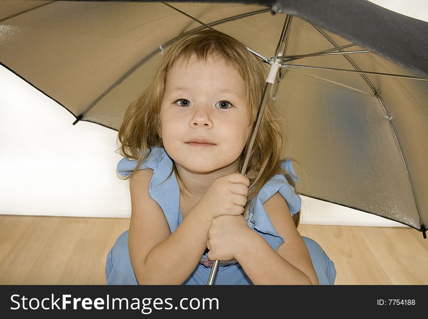 Small pretty girl is posing with umbrella. Small pretty girl is posing with umbrella