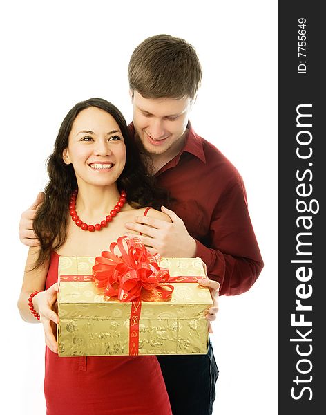 Happy couple, young man gives a present to his wife