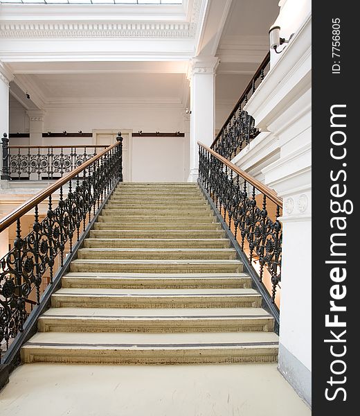 White stairway with metal railing