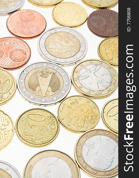 Collection of euro coins on white surface. Collection of euro coins on white surface