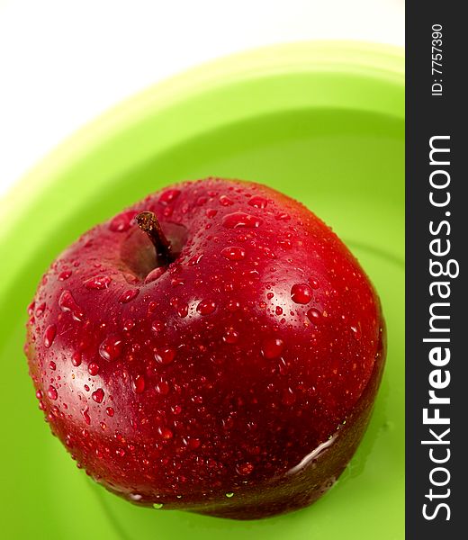 Apple in dish with water