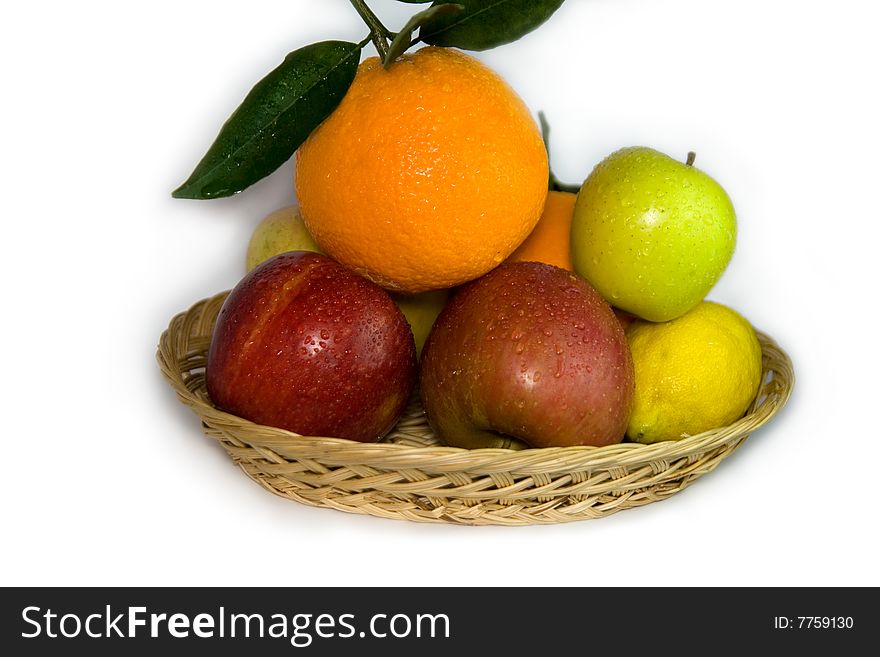 Orange, lemon, apple and plum on white background