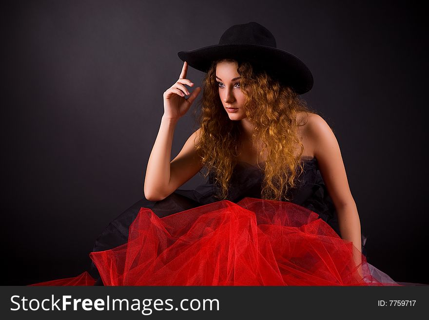 Attractive girl in hat, studio shot