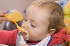 Little Baby Girl Eating In A High Chair Royalty Free Stock Photography Little Baby Girl Eating In A High Chair Royalty Free Stock Photography