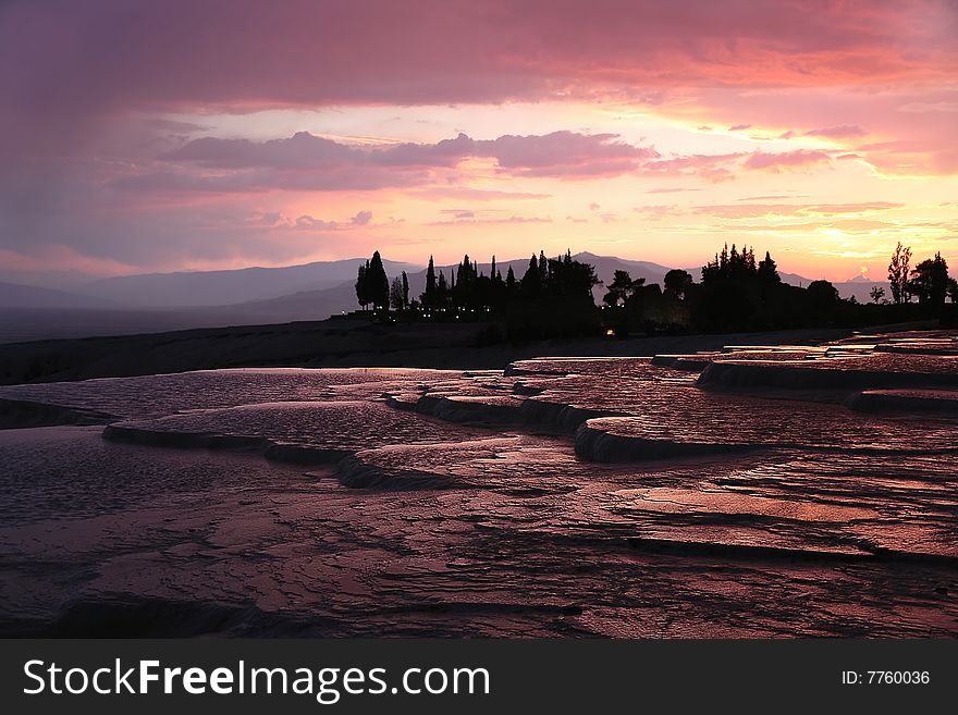 Travertines at Pamukkale at the sunset vibrant colors. Travertines at Pamukkale at the sunset vibrant colors