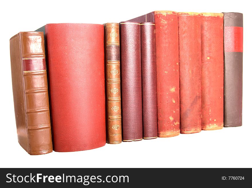 Old leather bound books isolated on a white background