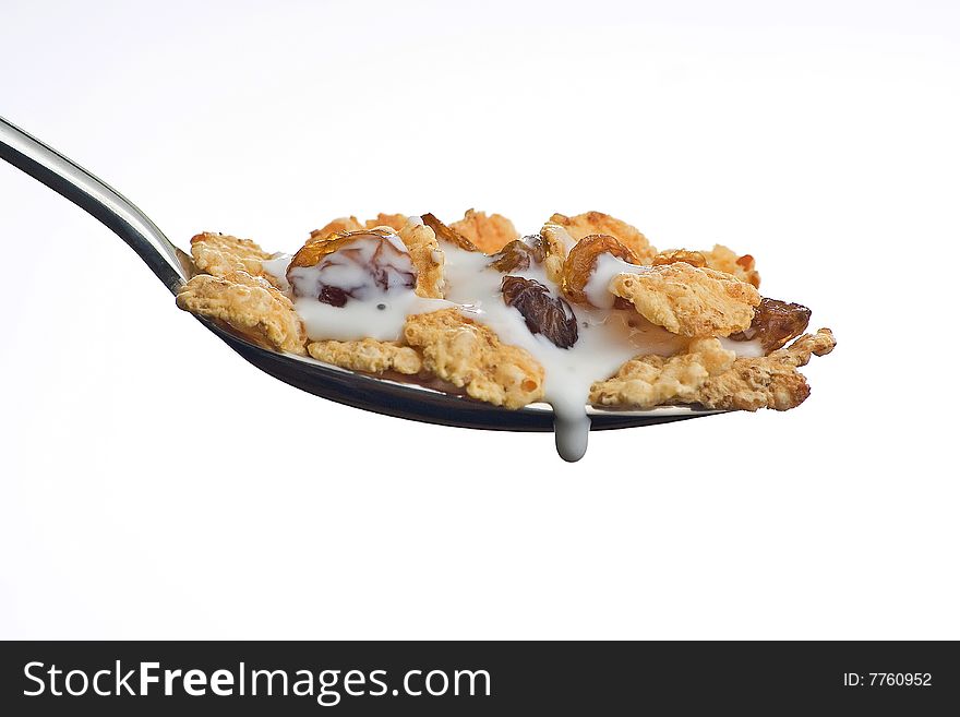 Bowl of cereal with raisins and milk isolated