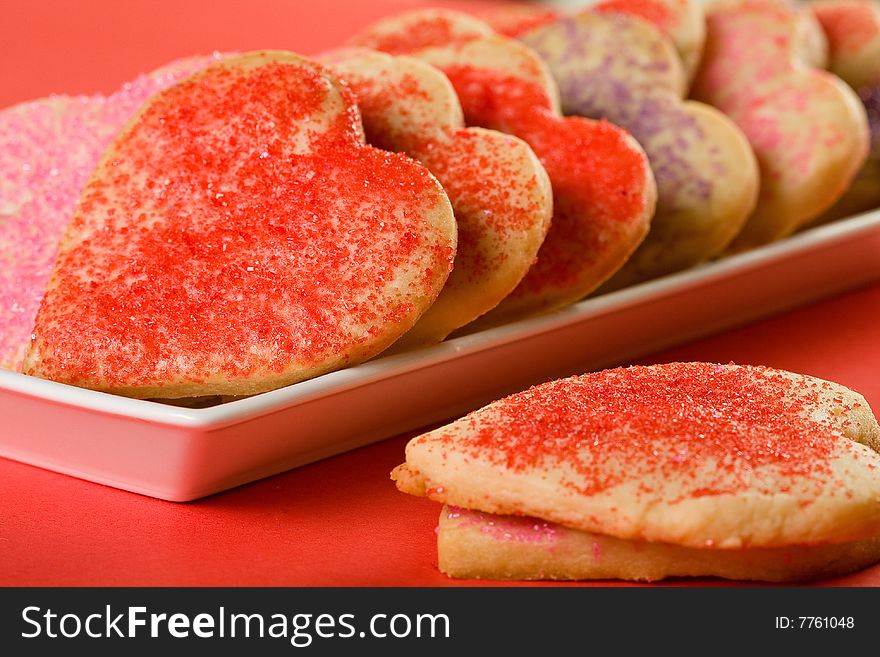 Heart shaped cookies in red, pink, and lavender