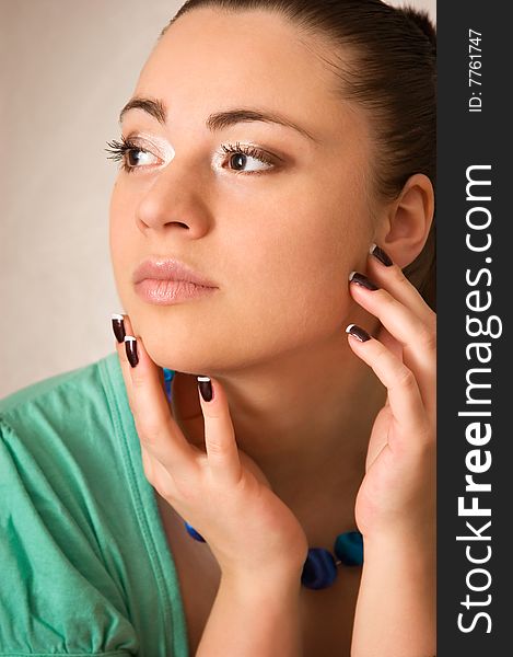 Portrait of the beautiful young woman on a grey background. Portrait of the beautiful young woman on a grey background