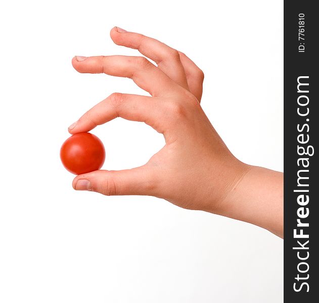 Hand with cherry tomato isolated on white background