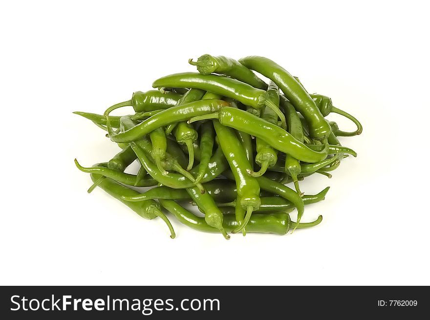 Dry green hot peppers at white. Dry green hot peppers at white