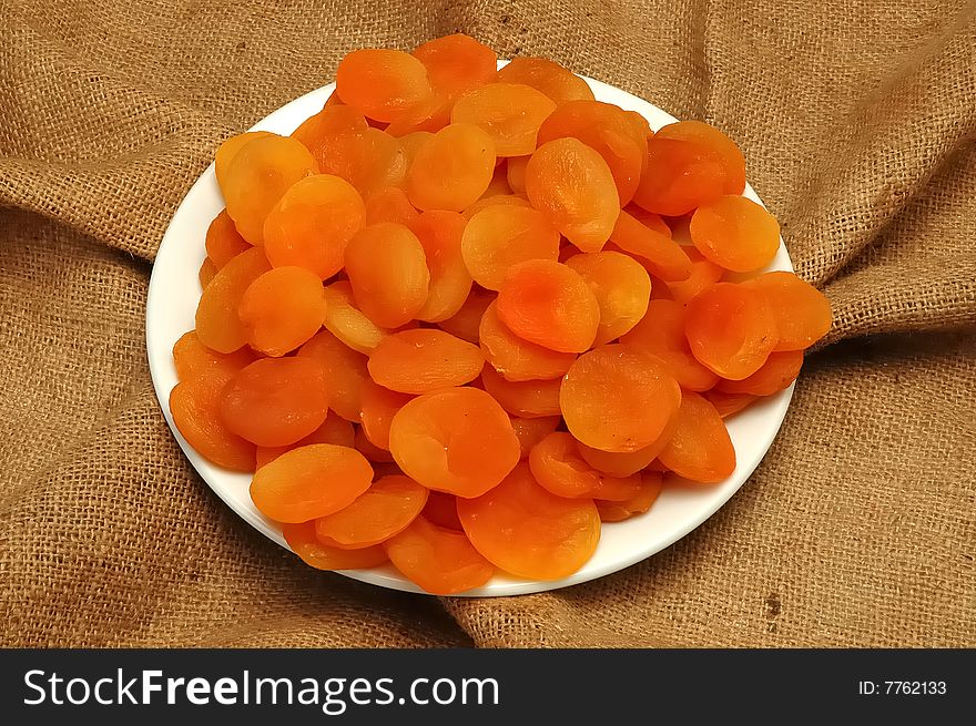 Dry apricots in white plate