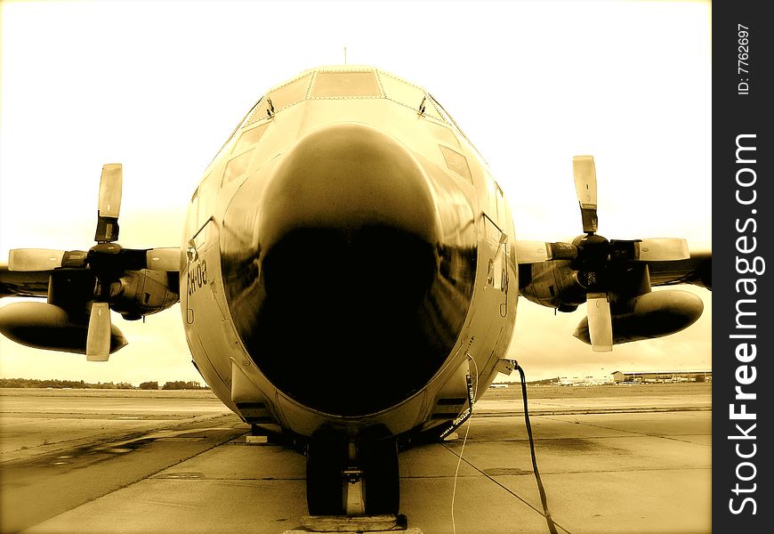 C 130 airplane Belgian army on tarmac, (front view) in sepia color. C 130 airplane Belgian army on tarmac, (front view) in sepia color.