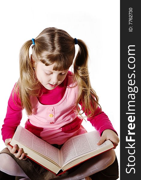 Stock photo: an image of a girl with a big book. Stock photo: an image of a girl with a big book