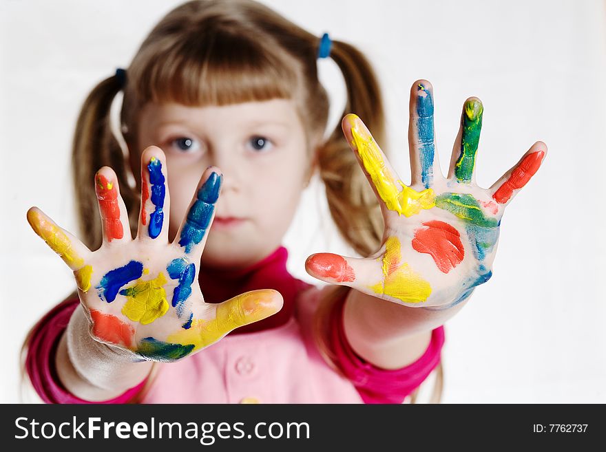 Stock photo: an image of a little girl with her hands in paint. Stock photo: an image of a little girl with her hands in paint