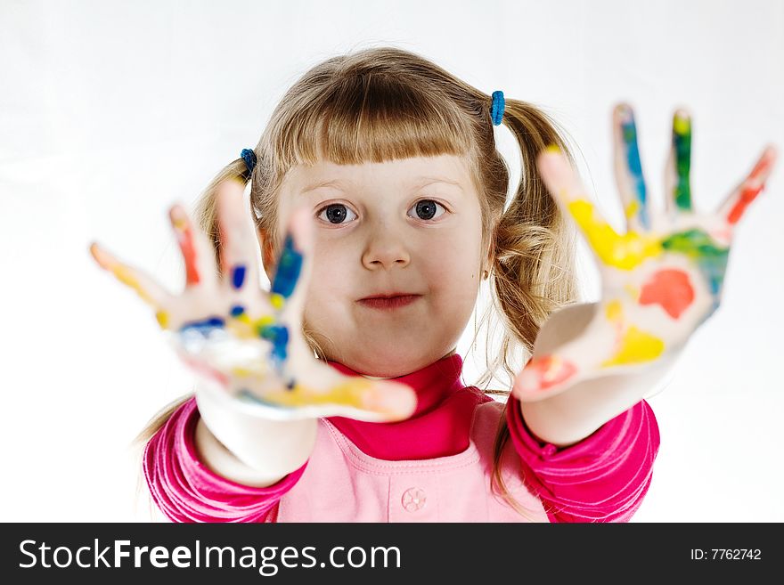 Stock photo: an image of a girl with her hands in paint