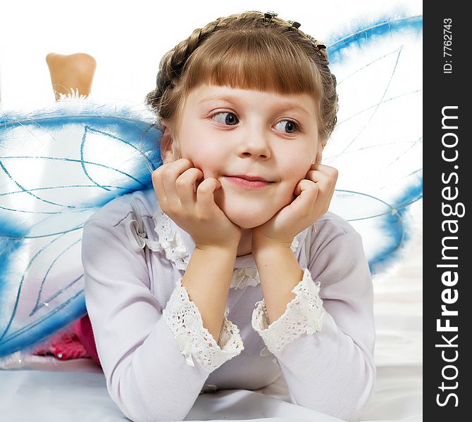 Stock photo: an image of a little girl dressed like blue butterfly
