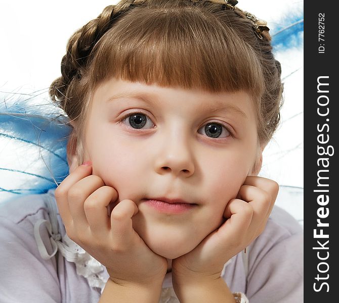Stock photo: an image of a little girl with blue wings