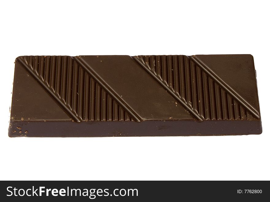 Bar of black chocolate on a white background it is isolated