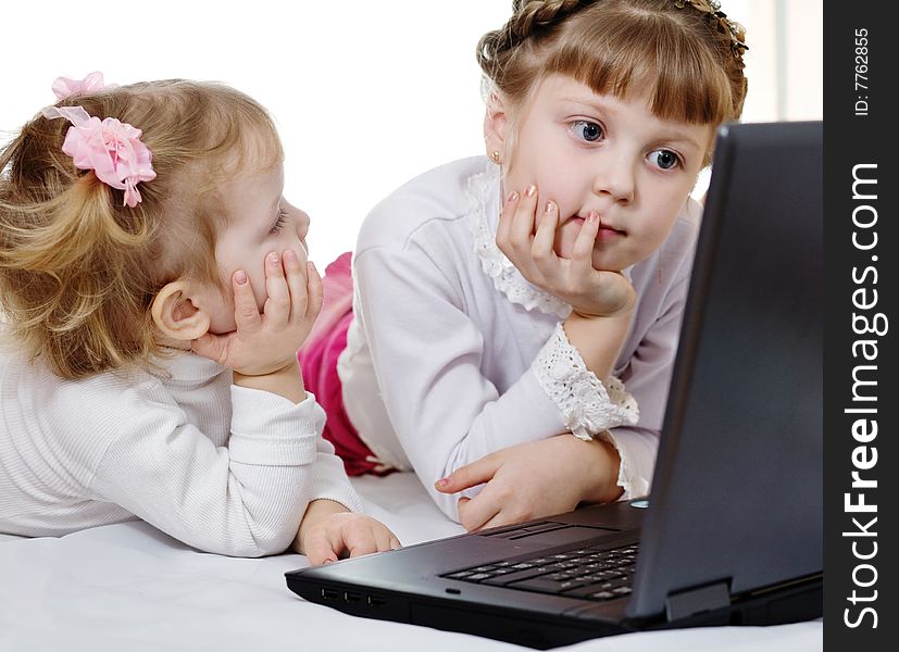 Stock photo: an image of two girls with a laptop. Stock photo: an image of two girls with a laptop
