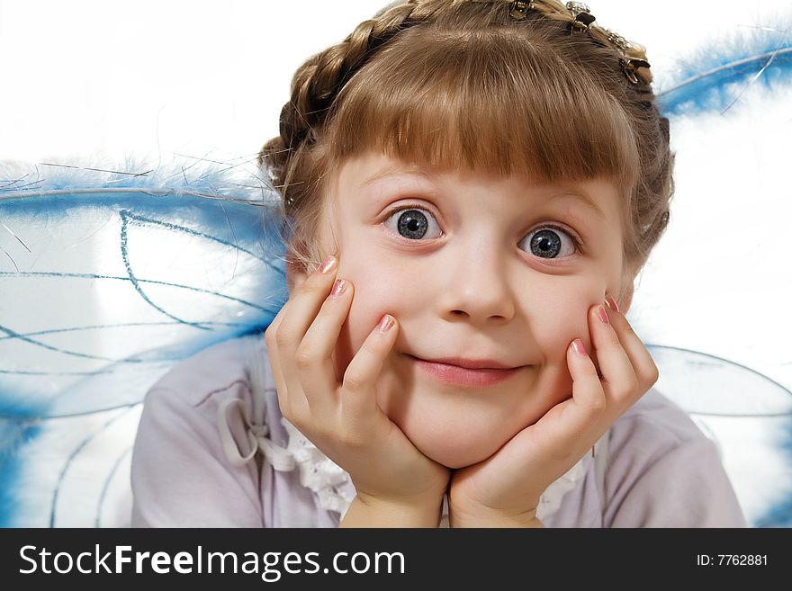 Stock photo: an image of a little girl with wings
