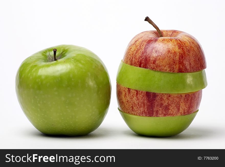 Red and green sliced apples isolated on white