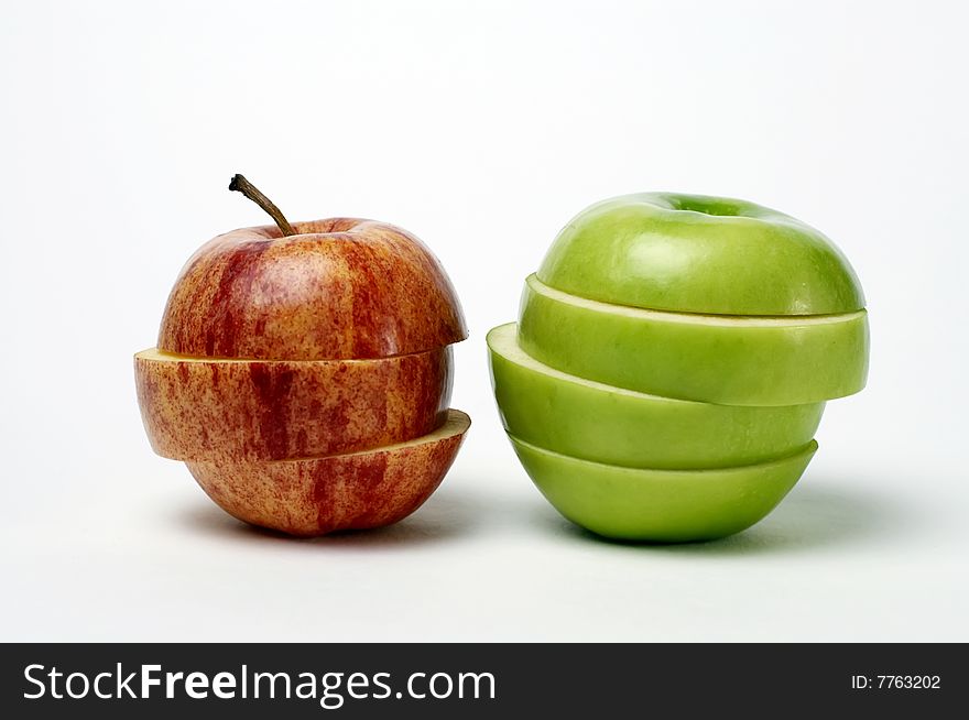 Red And Green Sliced Apples Isolated On White