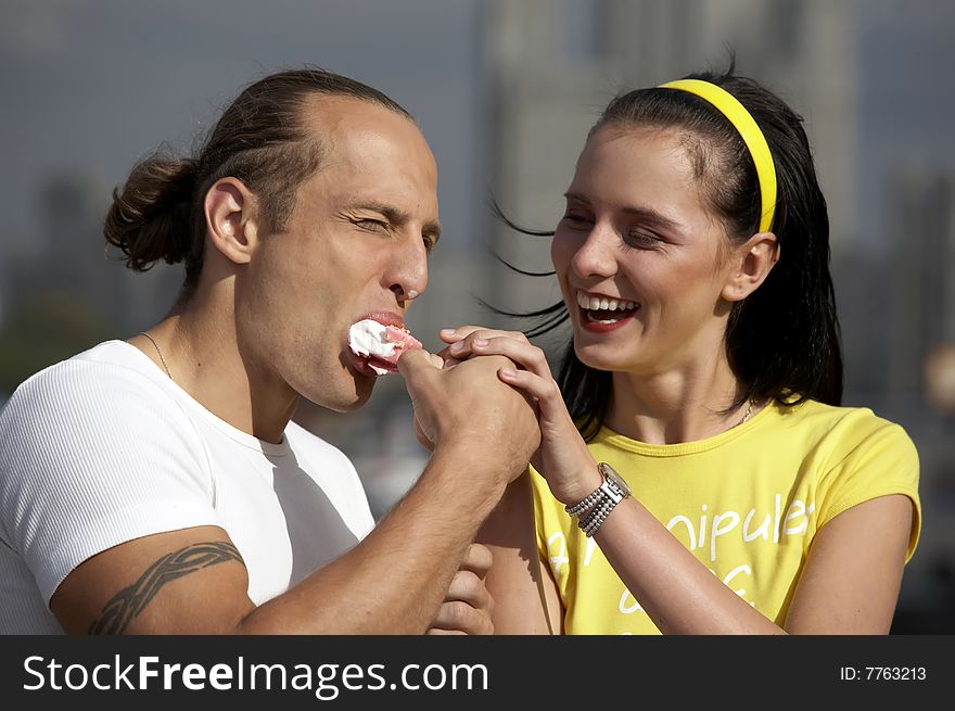 Playful love couple smiling outdoors. Playful love couple smiling outdoors