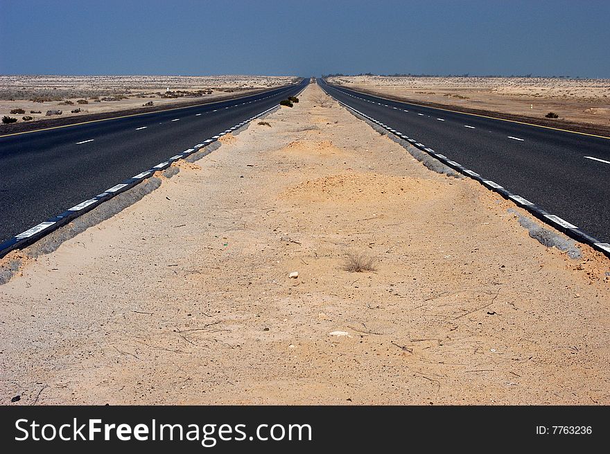 Road thru the desert near Dubai city. Road thru the desert near Dubai city.