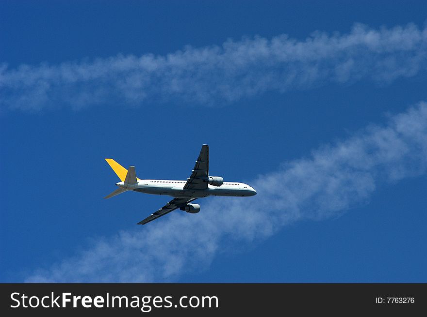 Passenger jet after take off, blue sky.