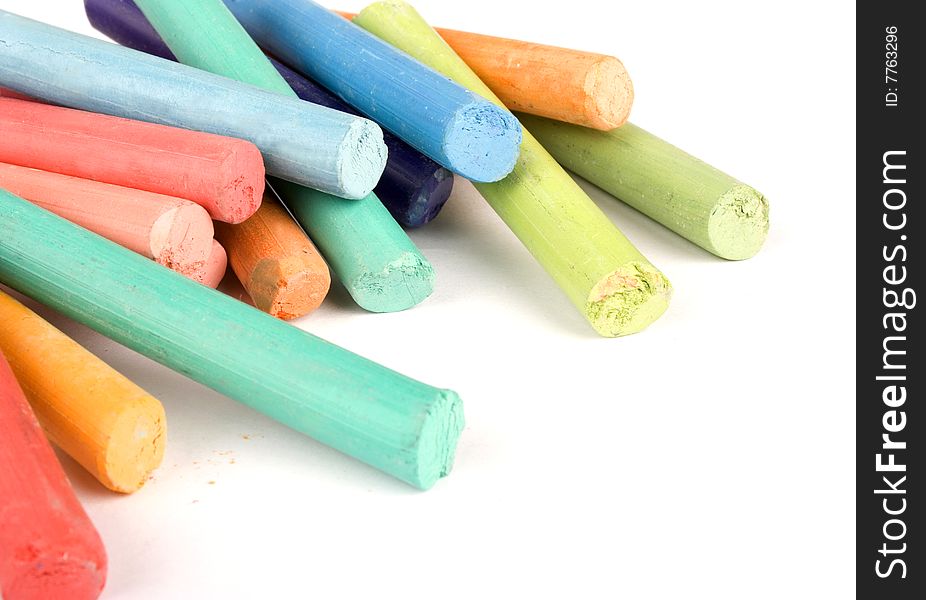 Multicolour crayons on white background