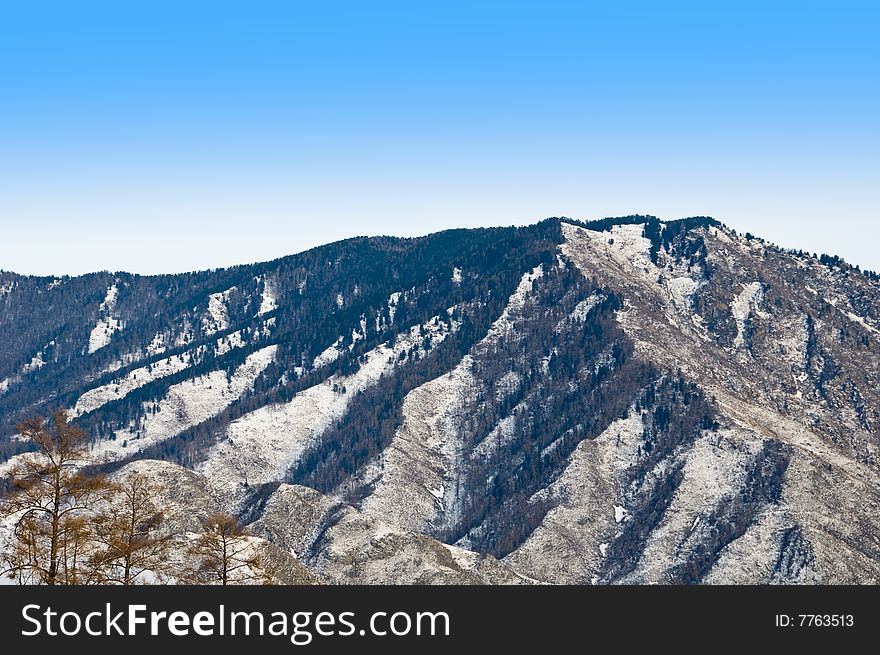 Peak of mountain. Winter in Altay. Siberia.